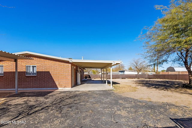 view of property exterior featuring a carport