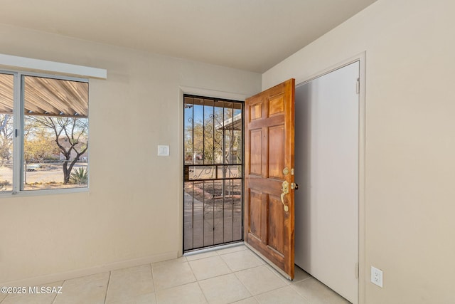 foyer with light tile patterned floors