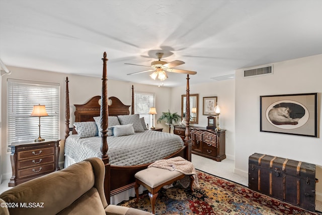 bedroom with light carpet and ceiling fan