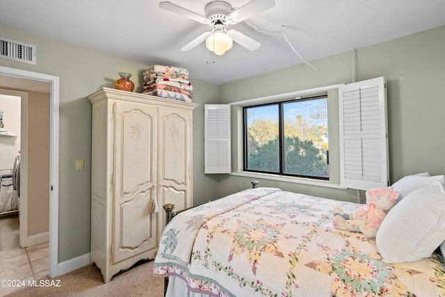 carpeted bedroom with ceiling fan