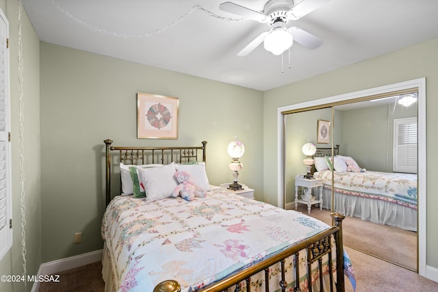 bedroom featuring a closet, baseboards, a ceiling fan, and carpet