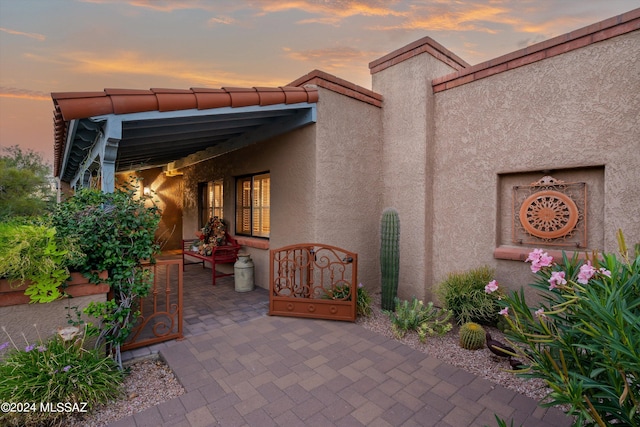 view of patio terrace at dusk