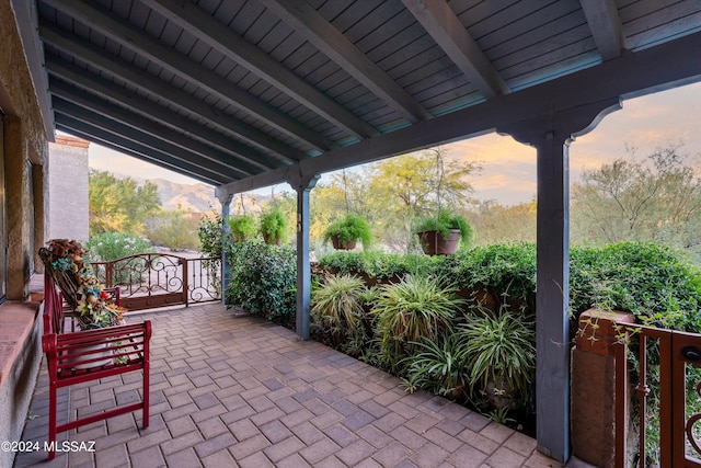 view of patio terrace at dusk