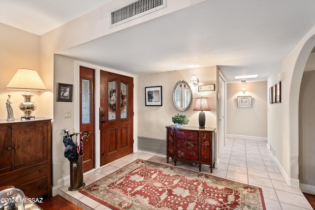 foyer featuring light tile patterned floors