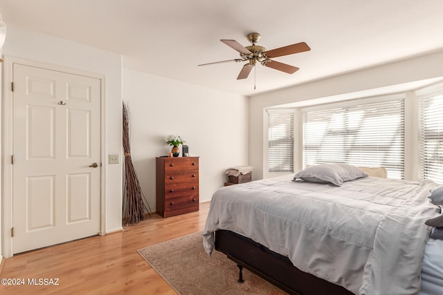 bedroom featuring ceiling fan and light wood-type flooring