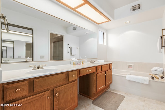 bathroom with independent shower and bath, vanity, and tile patterned floors