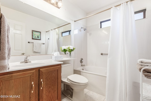 full bathroom featuring tile patterned flooring, vanity, toilet, and shower / bath combo with shower curtain