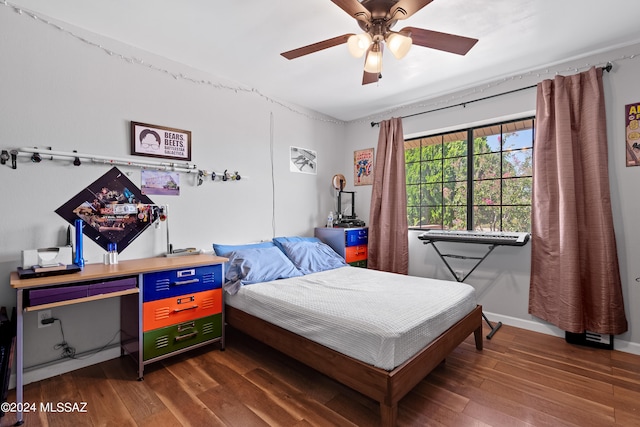 bedroom with ceiling fan and dark wood-type flooring