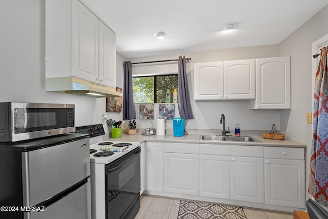 kitchen with a sink, stainless steel microwave, electric range, under cabinet range hood, and refrigerator