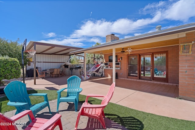 view of patio / terrace with an outdoor kitchen and a ceiling fan