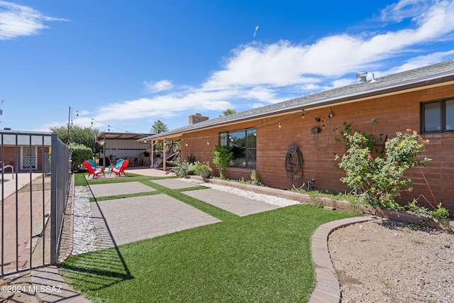 view of yard featuring a patio area and fence
