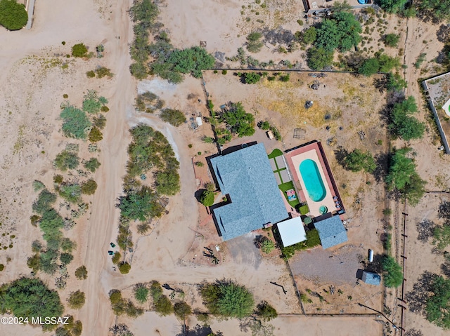 bird's eye view with a desert view and a rural view