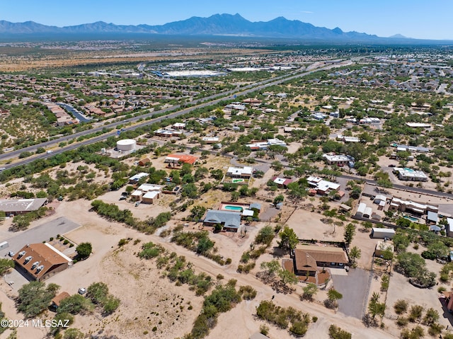 birds eye view of property featuring a mountain view