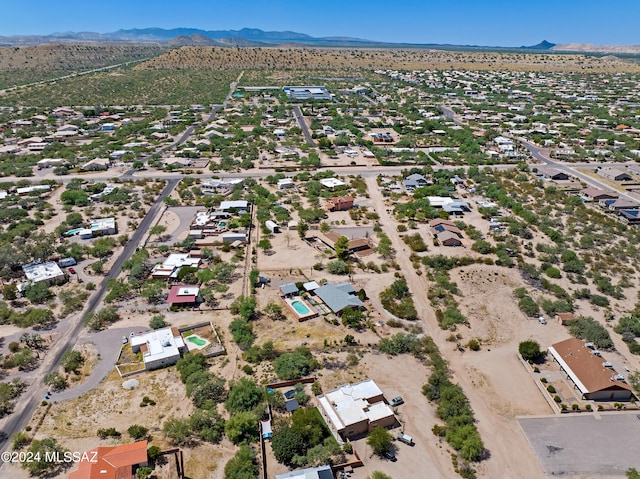 birds eye view of property with a mountain view