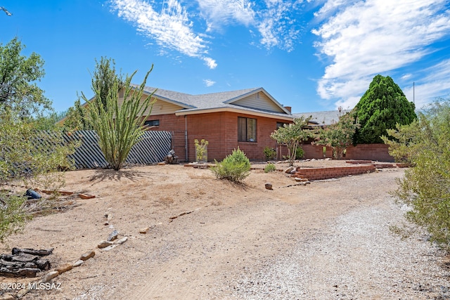 view of side of property with fence