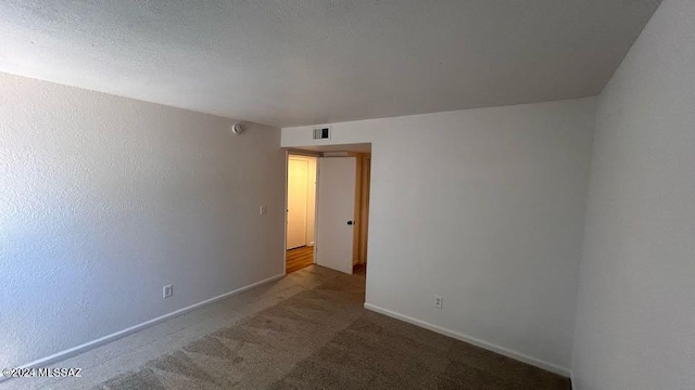 unfurnished room with carpet floors