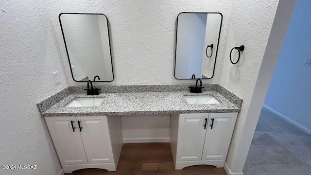 bathroom with vanity and hardwood / wood-style floors