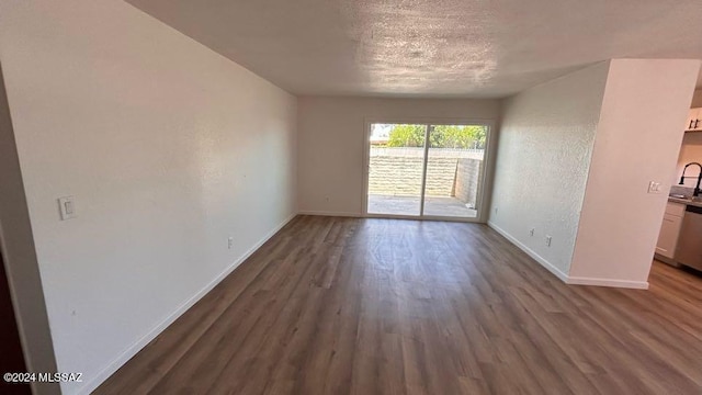 empty room with wood-type flooring