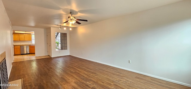 unfurnished living room with ceiling fan and light hardwood / wood-style floors