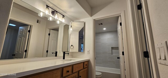 full bathroom featuring visible vents, shower / washtub combination, toilet, and vanity