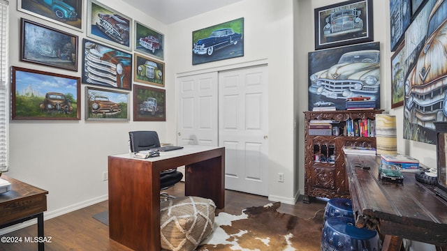 office with dark hardwood / wood-style flooring