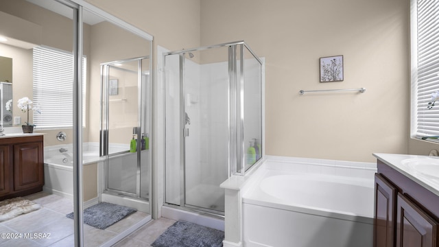 bathroom featuring vanity, plus walk in shower, and tile patterned flooring