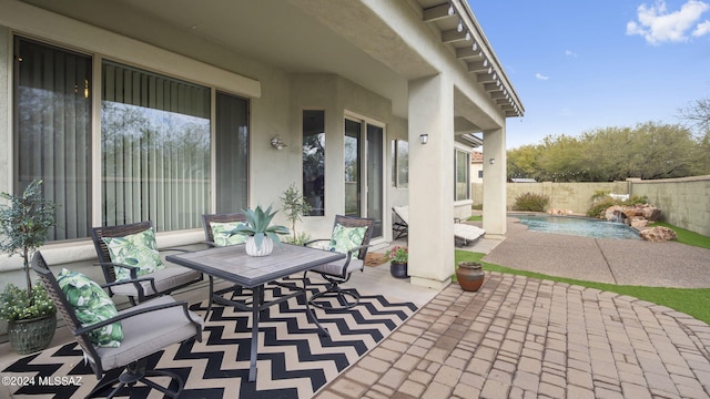 view of patio / terrace featuring a fenced in pool