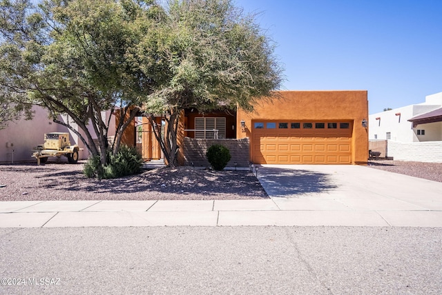 southwest-style home featuring a garage