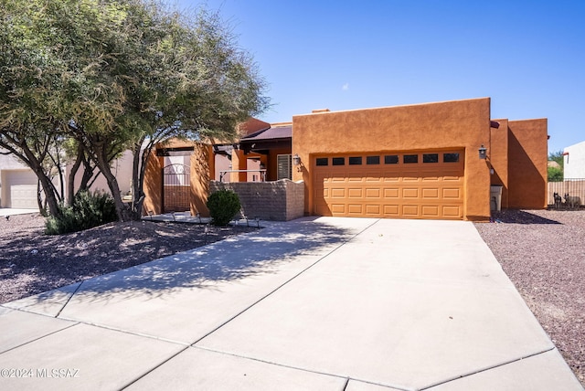 adobe home featuring a garage