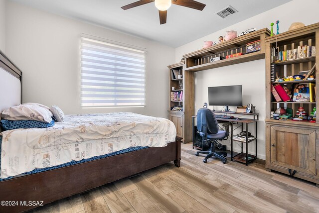 bedroom featuring light hardwood / wood-style floors and ceiling fan