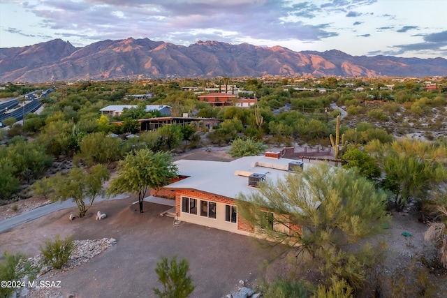 birds eye view of property with a mountain view