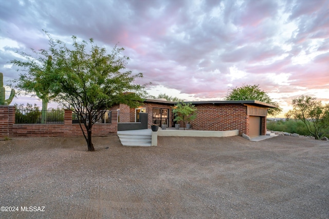 view of front of property with a garage