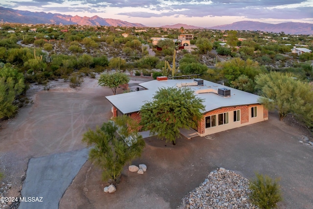 aerial view at dusk with a mountain view