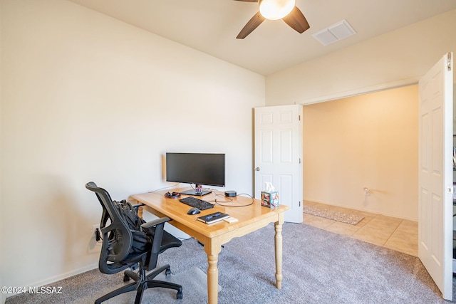 office space featuring light tile patterned floors and ceiling fan