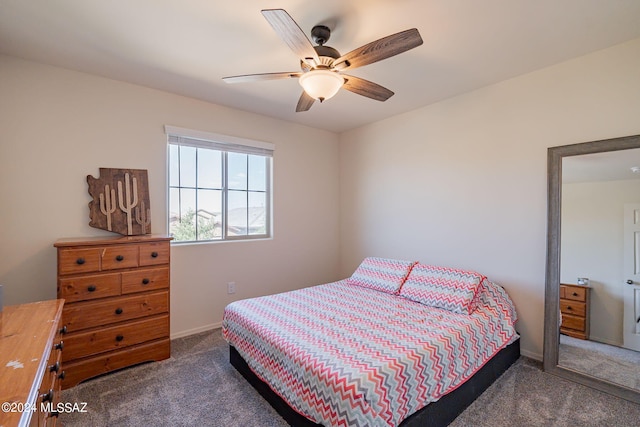 bedroom with ceiling fan and dark colored carpet