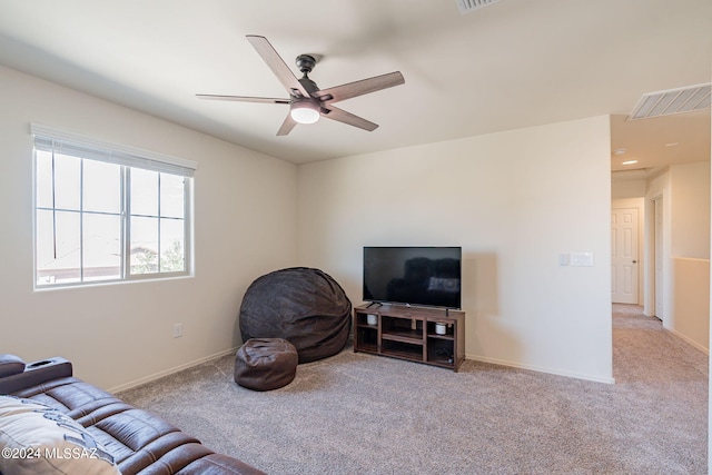 living room with ceiling fan and light carpet