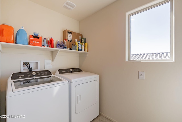 washroom featuring washer and dryer