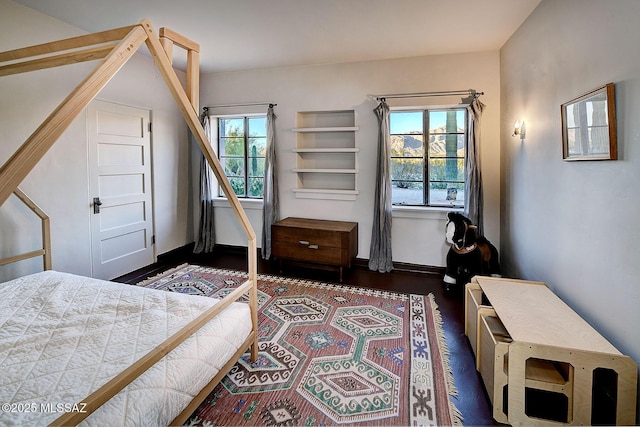 bedroom featuring dark hardwood / wood-style floors