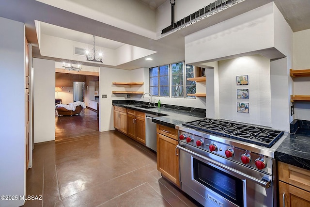 kitchen featuring a high ceiling, sink, decorative light fixtures, stainless steel appliances, and a chandelier