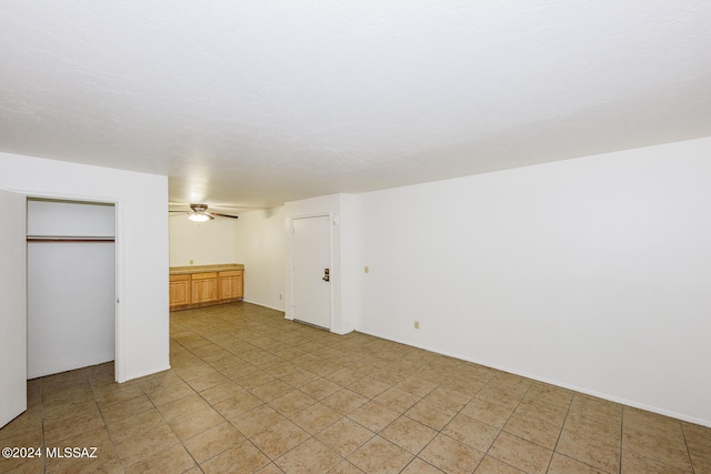 basement with ceiling fan