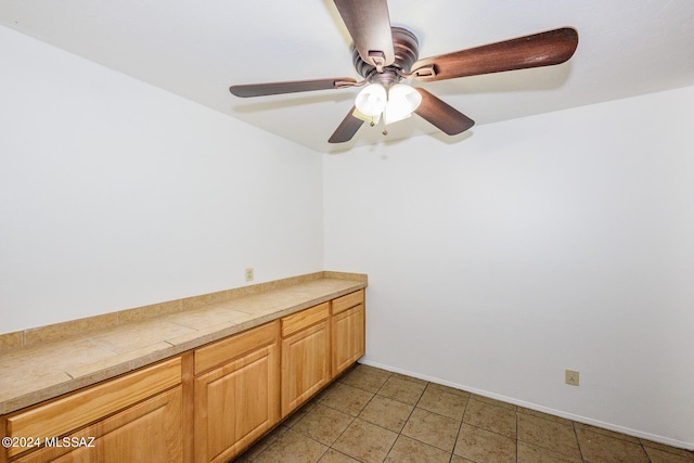 interior space featuring ceiling fan