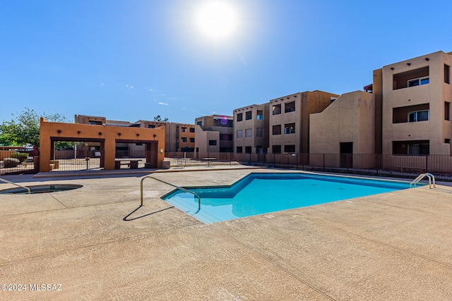 view of swimming pool featuring a patio