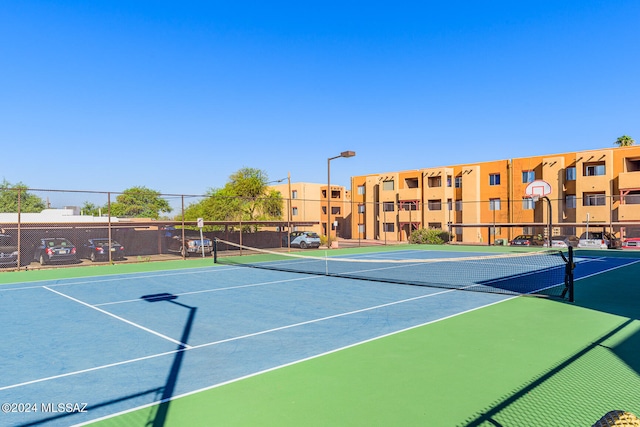 view of tennis court featuring basketball court