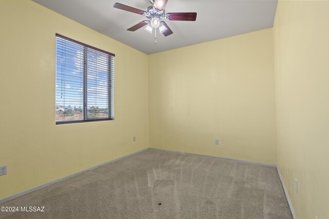 unfurnished room featuring carpet flooring and ceiling fan