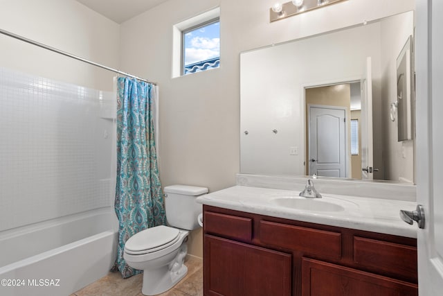 full bathroom featuring tile patterned flooring, vanity, toilet, and shower / tub combo