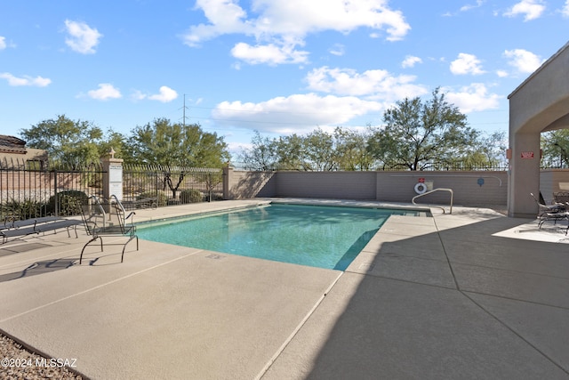 view of swimming pool featuring a patio area