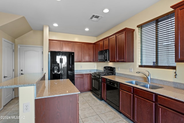 kitchen featuring black appliances, a kitchen island, sink, and light tile patterned flooring