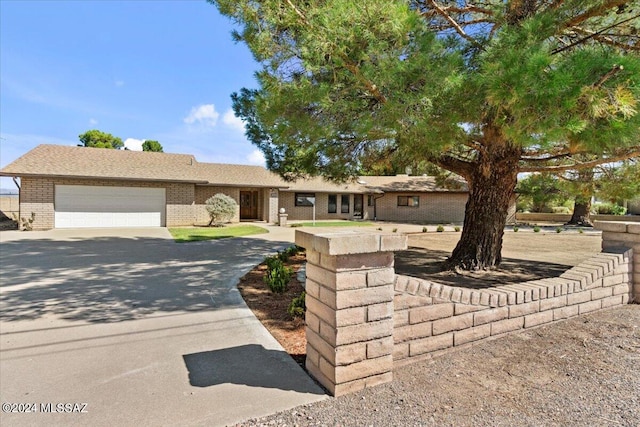 ranch-style home featuring a garage