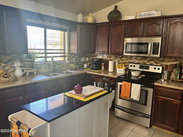 kitchen featuring light tile patterned floors, sink, dark brown cabinets, backsplash, and appliances with stainless steel finishes