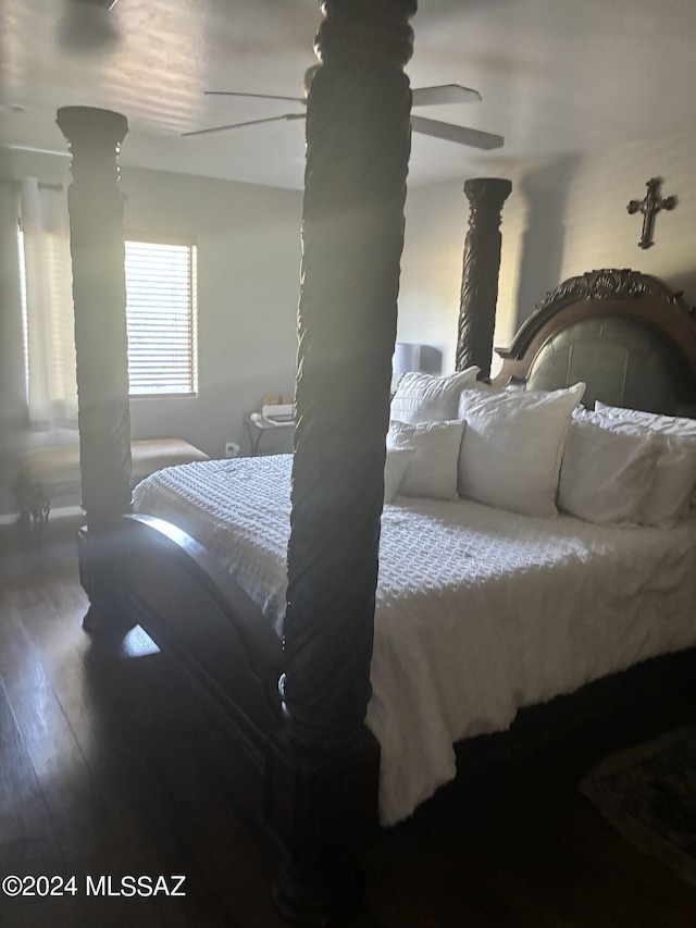 bedroom with ceiling fan and hardwood / wood-style flooring